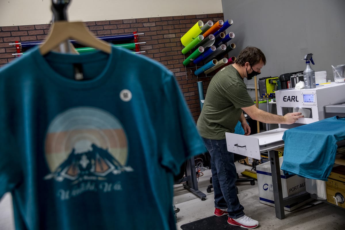 Rob Lewis working on clothes