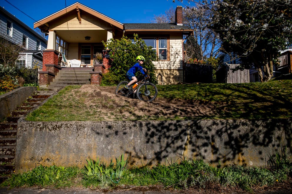 Hugo Flanagan, 8, rides his bike