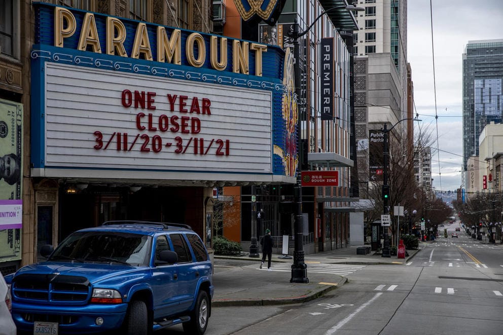 The marquee of the Paramount Theater seen from the street reads 