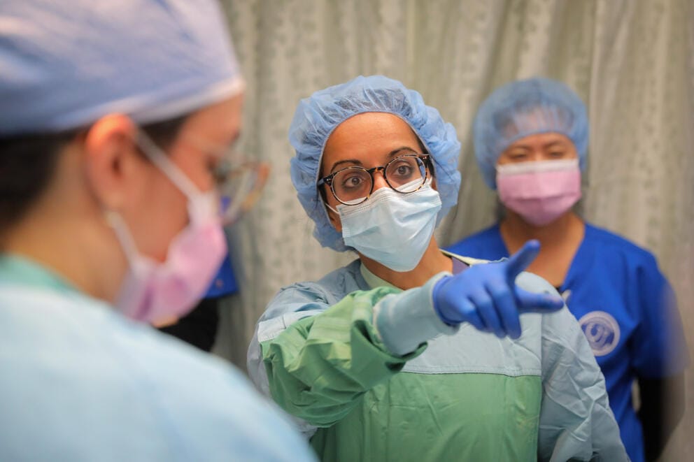 A close up of a surgical team during surgery