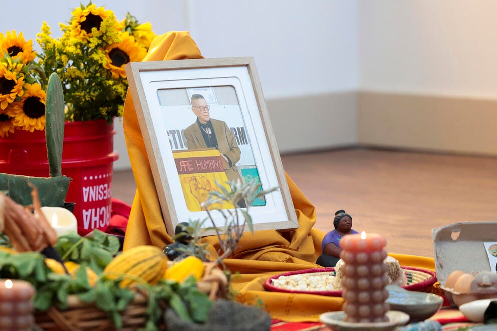 A photo of former Washington State Senator John McCoy amid a mistica display.
