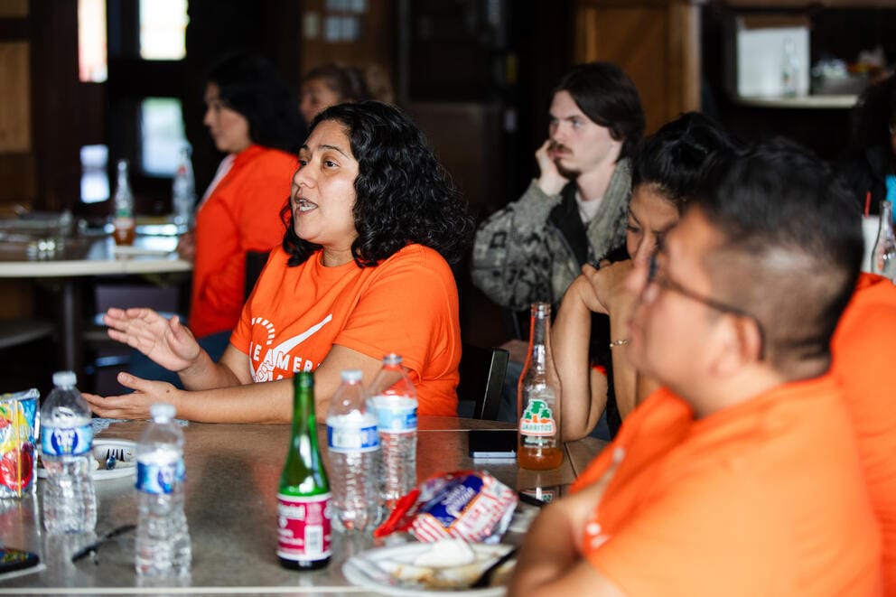 Elizabeth Ruiz talks about canvassing to staff and volunteers 