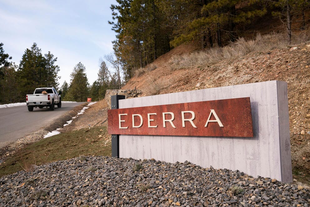 Truck passes Ederra development sign