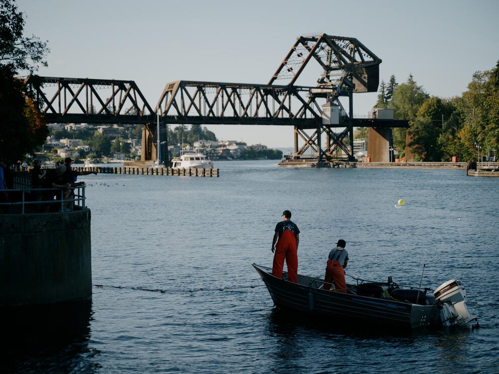 Two fisherman on a small fishing boat on the Puget Sound